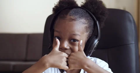 Webcam view of portrait of mixed race dark-skinned child emotional girl wearing Stock-Footage 142392194