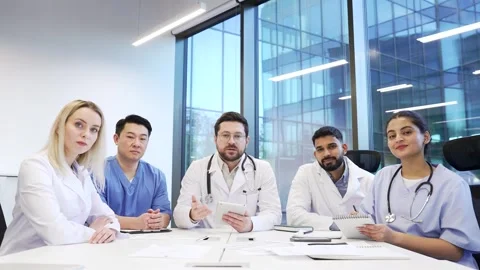 Webcam view. Team of doctors communicate at online conference by video call look Stock Footage 301974331
