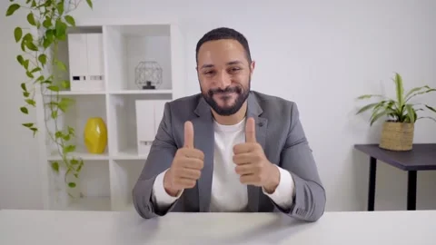 Webcam view of a video conference of a happy African-American businessman Stock Footage 168551943