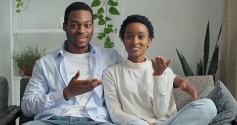 Webcam view of young ethnic mixed race couple man and woman sitting at home on Stock Footage 145489588