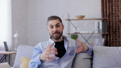 Webcam view.Handsome young man talking to web camera. Communication online with Stock Footage 164533268