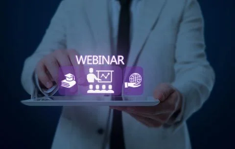 Webinar. Man holding tablet on dark blue background, closeup. Virtual scree.. Stock Photos
