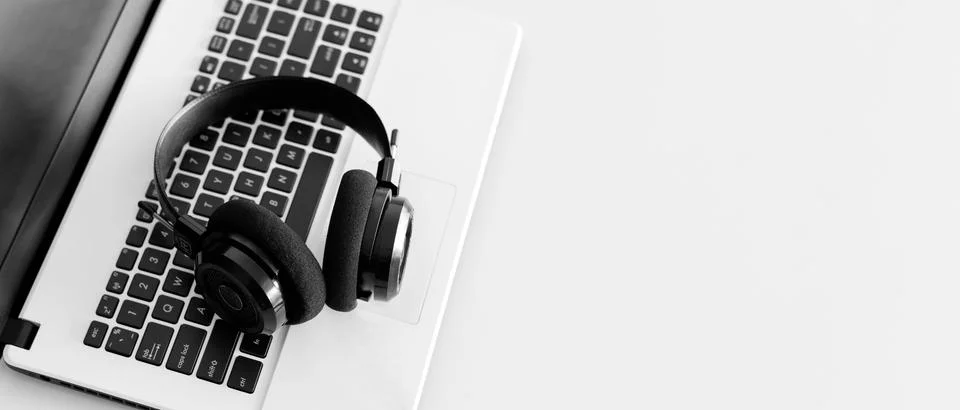 Webinar online and e-learning concept with laptop and headset, horizontal siz Stock Photos