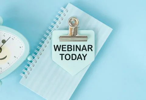 WEBINAR TODAY text written on a notebook on the blue background. Stock Photos
