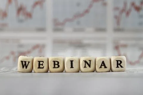 Webinar word built with letter cubes on newspaper backgound Stock Photos