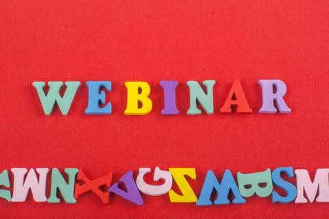 WEBINAR word on red background composed from colorful abc alphabet block wo.. Stock-Fotos