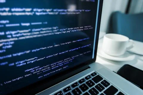 Website Coding. Website HTML Code on the Laptop Display Closeup Photo. Webdes Stock Photos