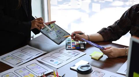 Website developer team brainstorming and planning about mobile app interface 写真素材