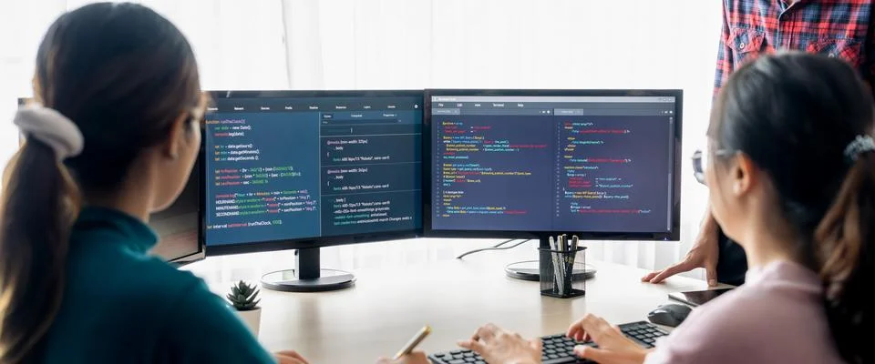 Website developer team brainstorming and sharing idea at office. Burgeoning. Stock Photos