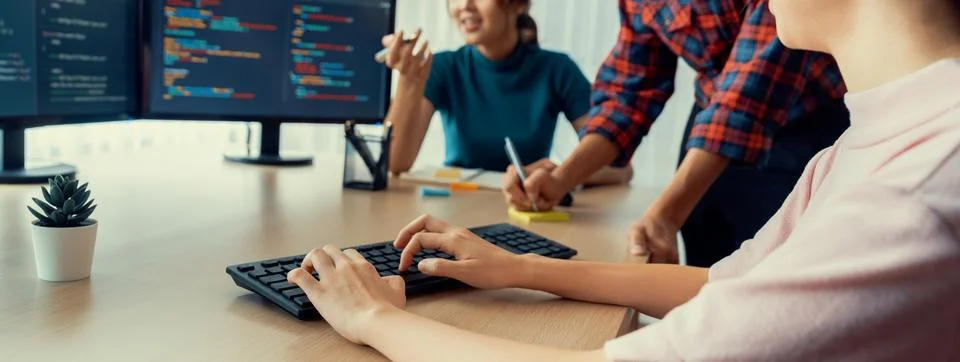 Website developer team brainstorming and sharing idea at office. Burgeoning. Stock Photos