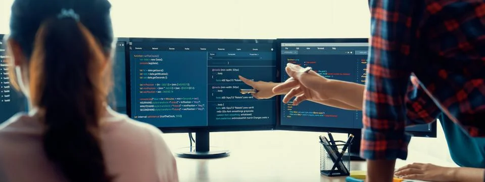 Website developer team brainstorming and sharing idea at office. Burgeoning. Stock Photos