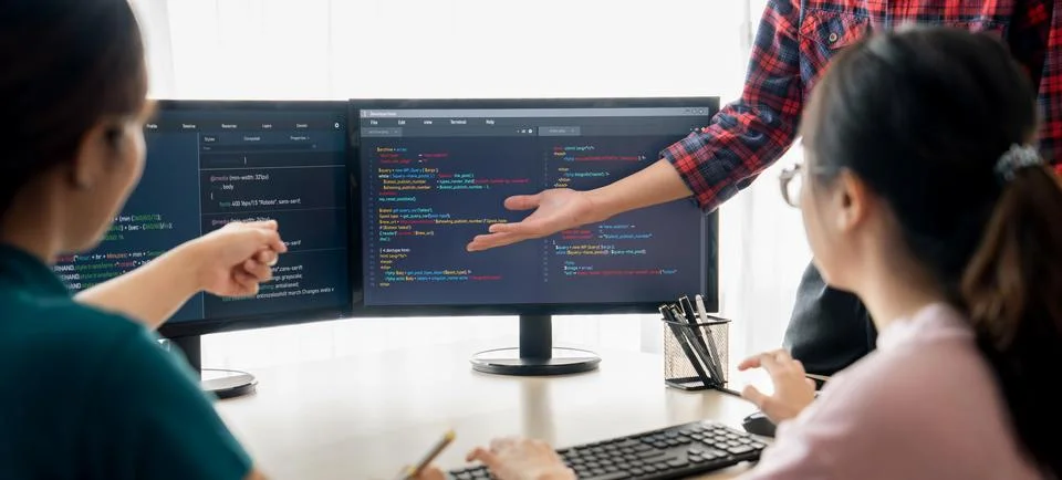 Website developer team brainstorming and sharing idea at office. Burgeoning. Stock Photos