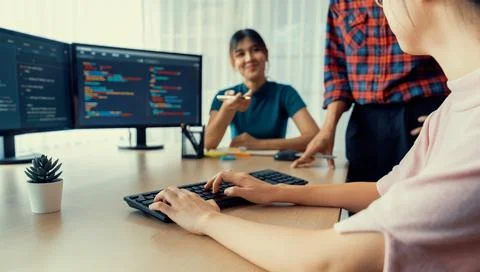 Website developer team brainstorming and sharing idea at office. Burgeoning. Stock Photos