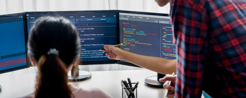 Website developer team brainstorming and sharing idea at office. Burgeoning. Stock Photos