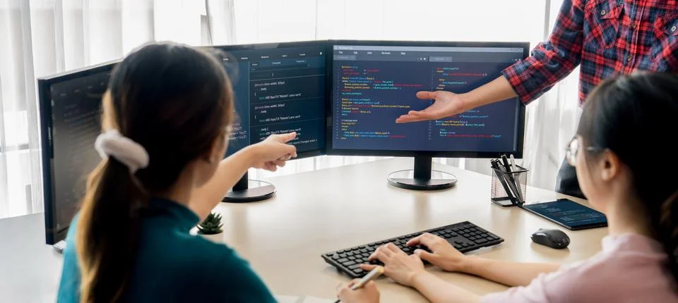 Website developer team brainstorming and sharing idea at office. Burgeoning. Stock Photos