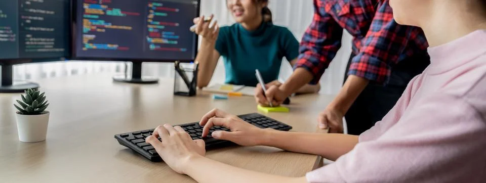Website developer team brainstorming and sharing idea at office. Burgeoning. Stock Photos