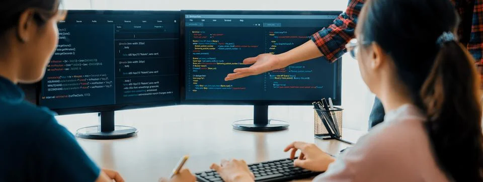 Website developer team brainstorming and sharing idea at office. Burgeoning. Stock Photos