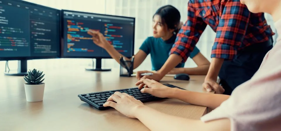 Website developer team brainstorming and sharing idea at office. Burgeoning. 库存照片