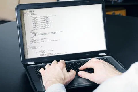 Website development process - programmer writing code Foto stock