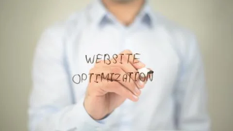 Website Optimization , man writing on transparent screen Stock Photos