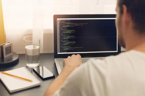 Website programmer working on laptop at office Stock Photos