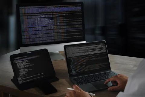 A website programming image shows person working with multiple electronic dev Foto stock
