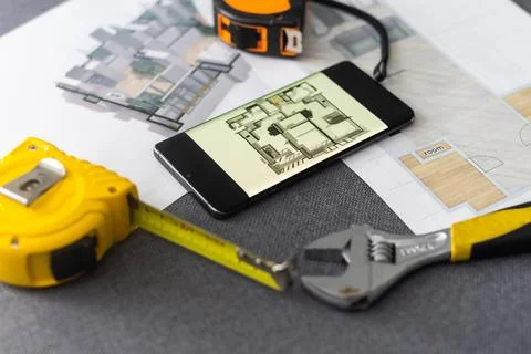 Website wireframe sketch and programming code on smartphone 写真素材