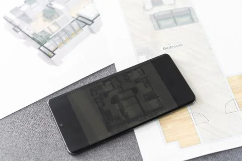 Website wireframe sketch and programming code on smartphone 스톡 사진