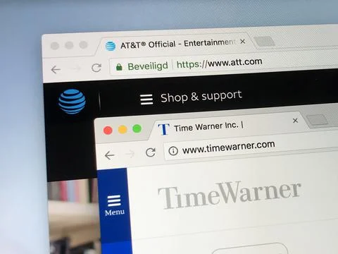 Websites of AT&amp;T and Time Warner. Stock Photos