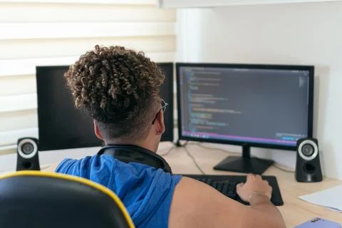 A website/software developer busy coding in his studio Stock Photos