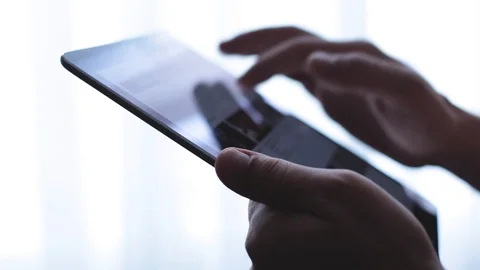 Websurfing on digital tablet on window background Stock Footage 93305315