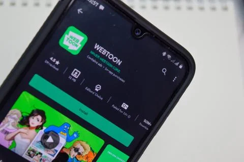 WEBTOON dev app with magnifying on Smartphone screen Stock-Fotos