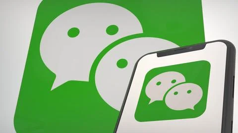 WeChat app logo in mobile display screen and background editorial Stock-Fotos