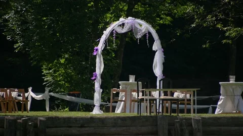 Wedding arch and rows of empty chairs on the lawn Stock Footage 162245553
