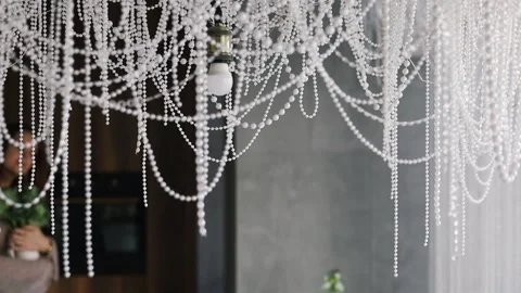 Wedding arch decor elements. Hanging shiny beads hang from ceiling and decorate Stock Footage 287505635