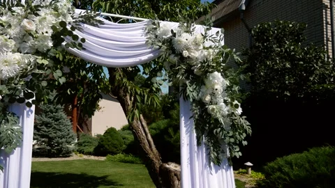 Wedding arch decorated with white flowers and eucalyptus leaves Stock Footage 343683743