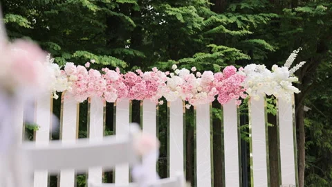 Wedding arch with fresh flowers on summer sunny wedding day. Wedding Decorations Video stock 196005259