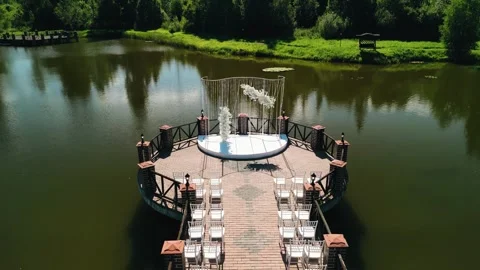 The wedding arch is located in the middle of the pond Stock Footage 302930089