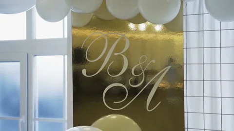 Wedding arch with lots of white balloons and with a square gold sign Video stock 147018467
