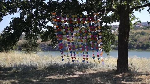 Wedding arch made of hearts on a string sway in the wind Stock Footage 73727870