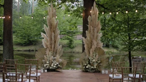 Wedding arch made of pampas grass on a green natural background. Stock Footage 256655926