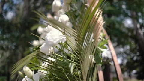 Wedding arch of white rose flowers the wedding ceremony of the bride and groom Stock Footage 282910056