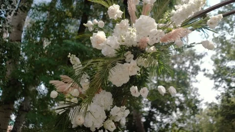 Wedding arch of white rose flowers the wedding ceremony of the bride and groom Stock Footage 282910126