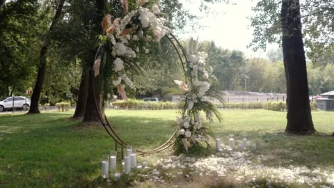 Wedding arch of white rose flowers the wedding ceremony of the bride and groom Video stock 282910190