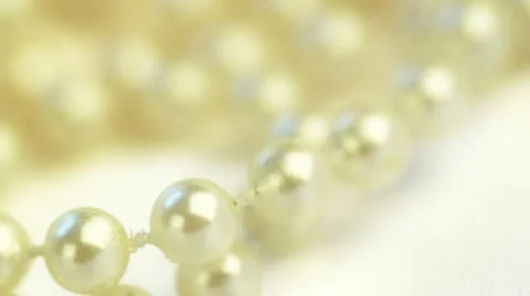 Wedding background. beads on silk spinning closeup Stock Footage 12187325