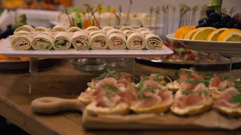 Wedding banquet, table with snacks, meat sliced ​​vegetables, greens 스톡 동영상 85370696