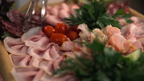 Wedding banquet, table with snacks, meat sliced ​​vegetables, greens Stock Footage 85370722