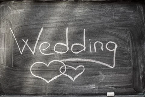 Wedding on blackboard and chalks. Stock Photos