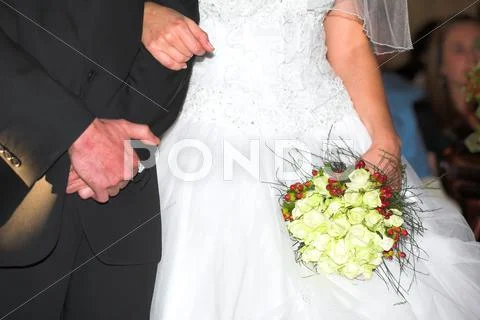 Wedding Bouquet And Bridal Couple