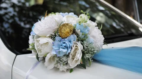 Wedding bouquet and ribbons on the front of the wedding car Stock Footage 288472937